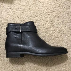 Stylish black ankle bootie with buckle